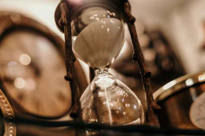 shallow focus photography of hourglass